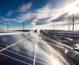 Bild mit Solarpanels und Windrädern